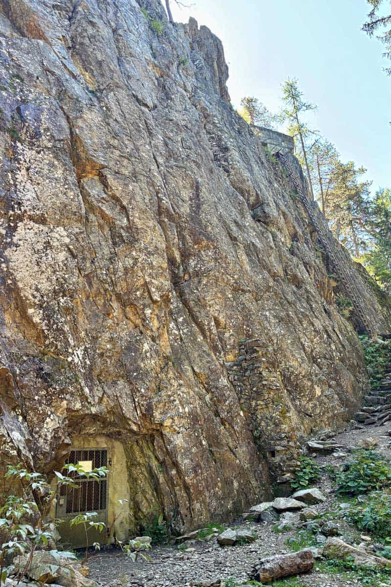 Gated opening in sheer cliff face on Stage 7 of the Tour du Mont Blanc.