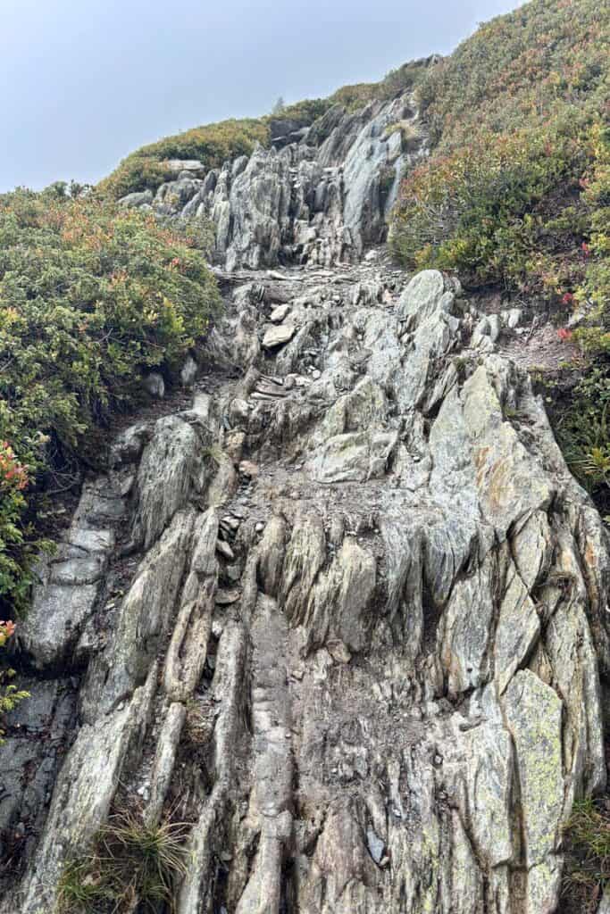 Rugged and steep rock trail on Tour du Mont Blanc Stage 9.