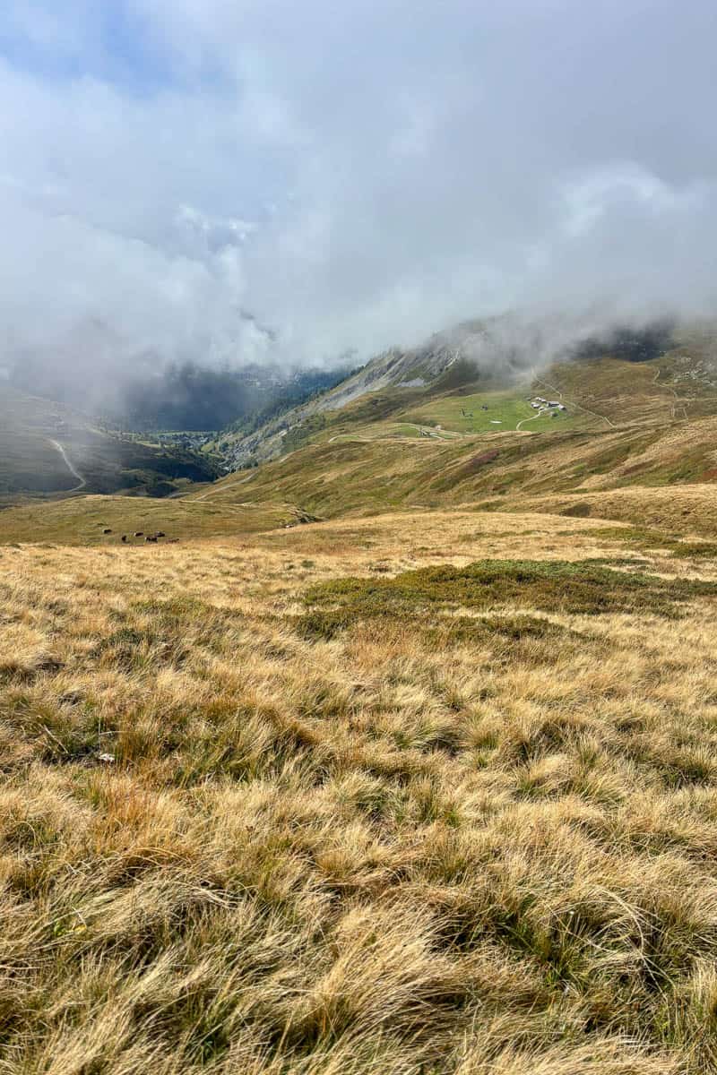 Sloping mountainside with clouds obscuring the view.