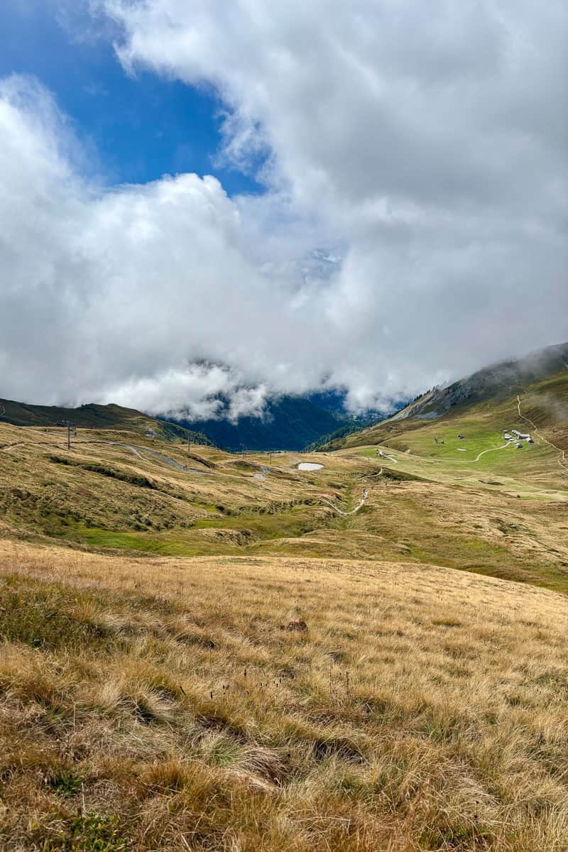 Sloping mountainside with clouds obscuring the view.
