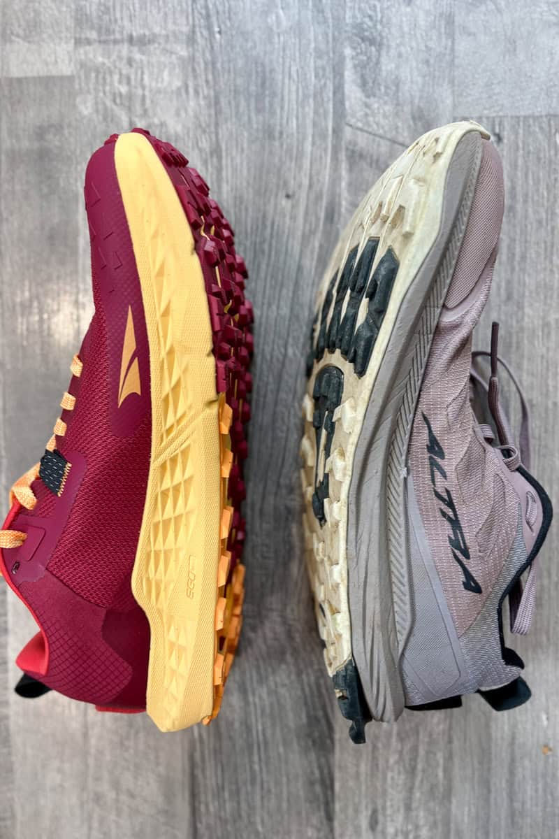 Altra Timp shoe lined up sole to sole with Altra Lone Peak shoe.