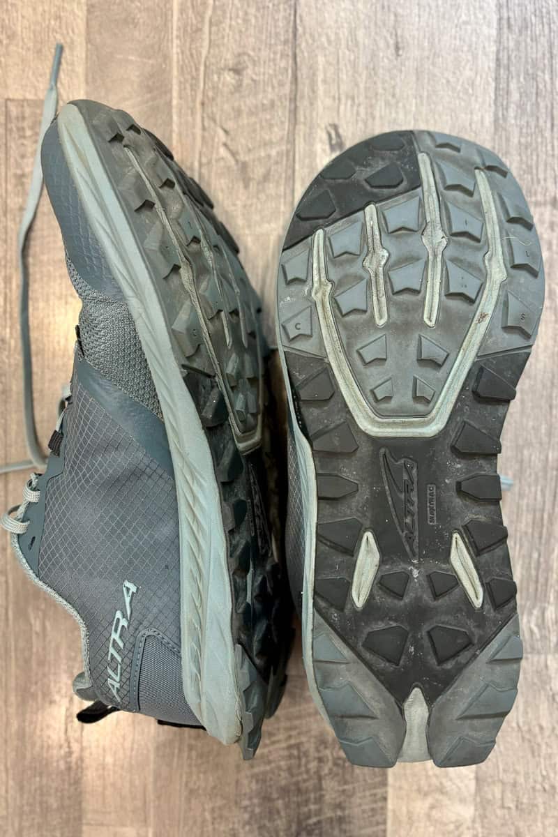 Altra Superior trail runners, with one shoe turned to show the sole and one shoe turned to show the side.