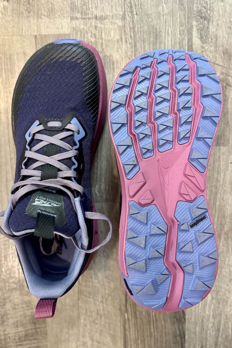 Pair of Altra Experience Wild trail runners with one shoe turned to show the sole.