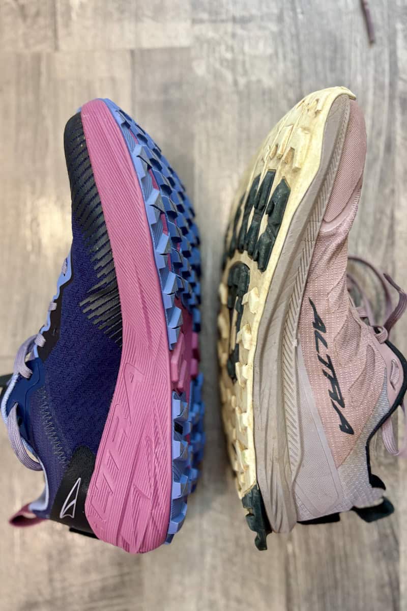 Altra Experience Wild trail runner shoe lined up sole to sole with Lone Peak shoe.