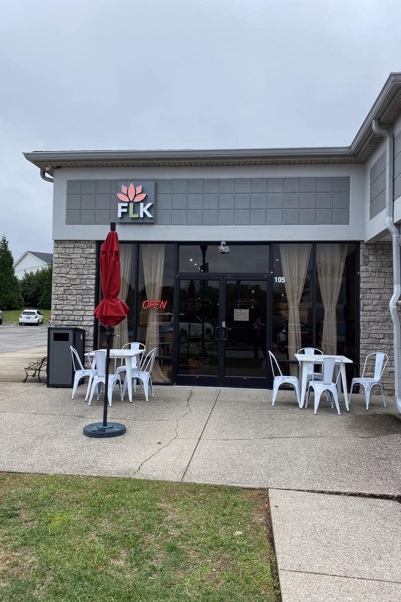 Floating Lotus Kitchen exterior with outdoor tables and chairs.