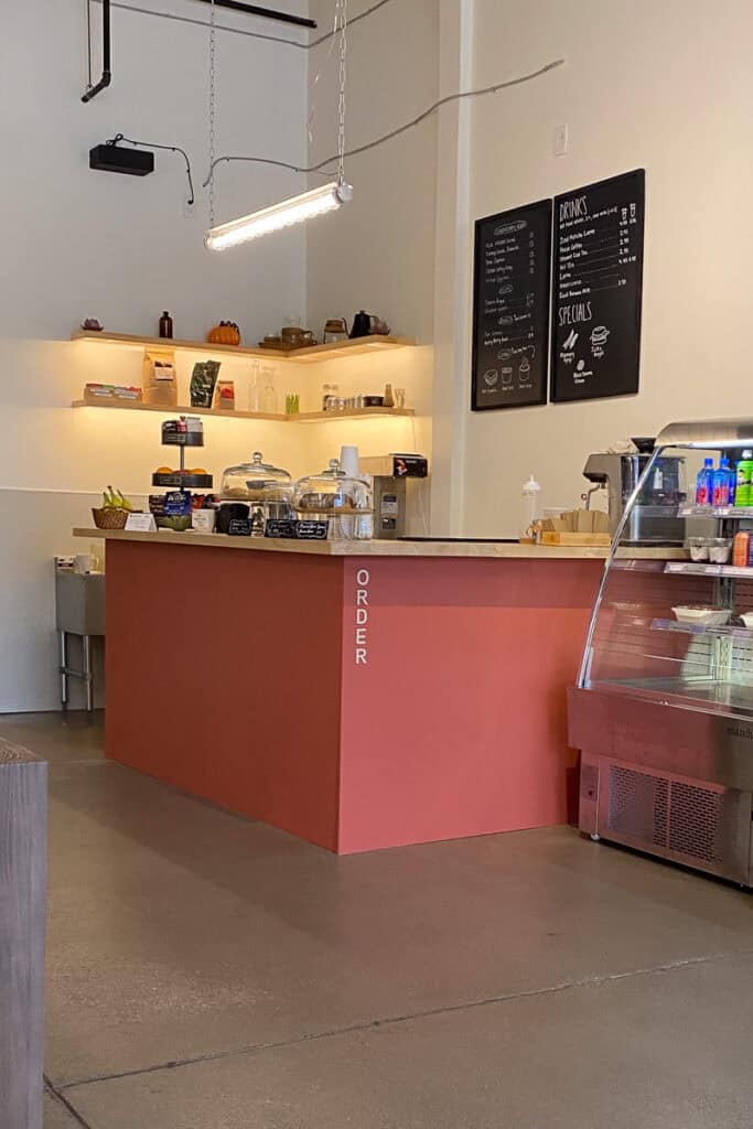 Ordering counter with display cases of baked goods.