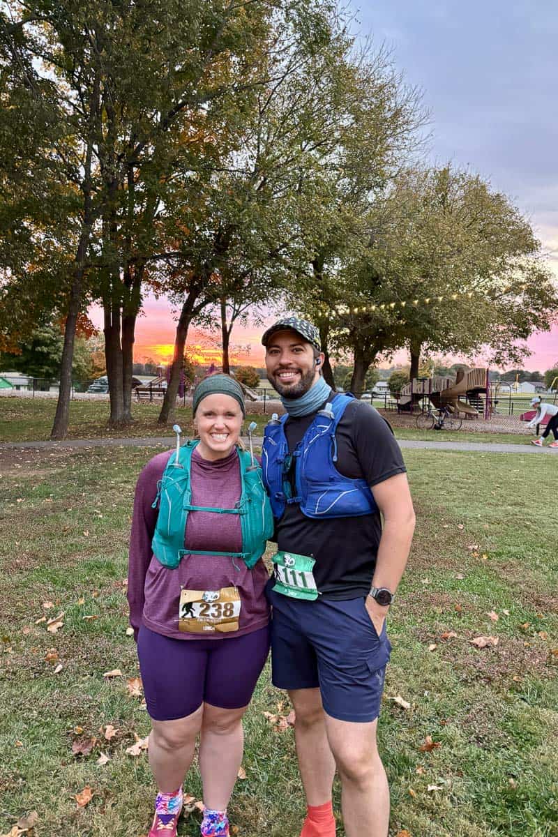 Couple wearing running vests and race bibs at start of Mammoth Cave race.