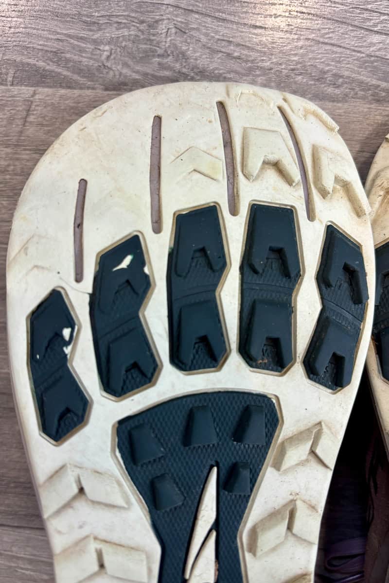 Bottom of Lone Peak 9 shoe with some of the tread worn down after 200 miles of use.