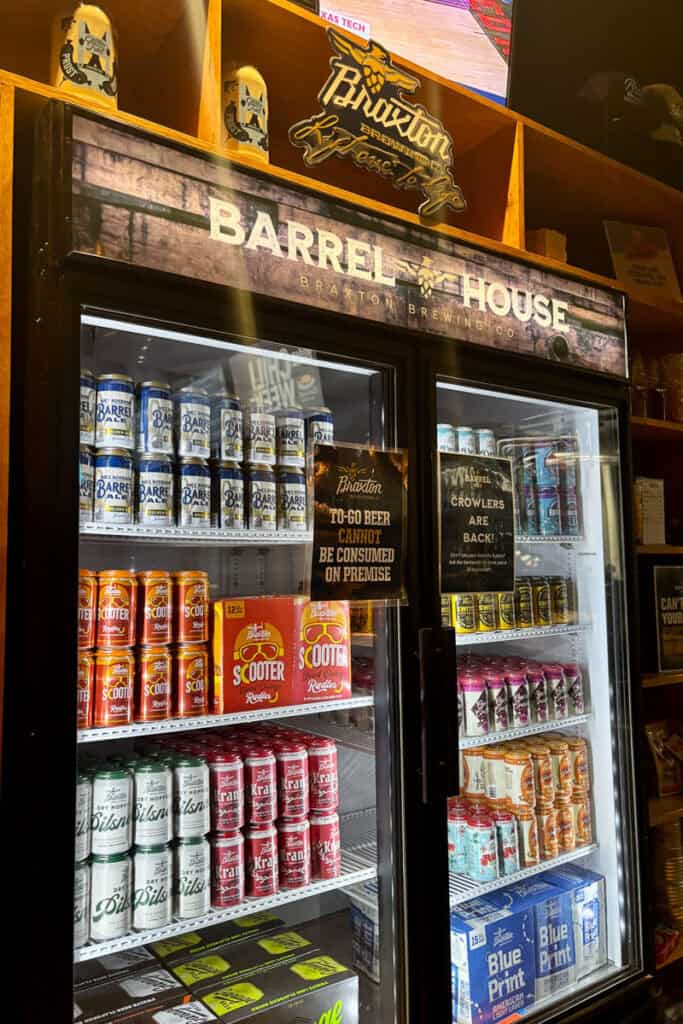 Coolers of canned beer for sale.