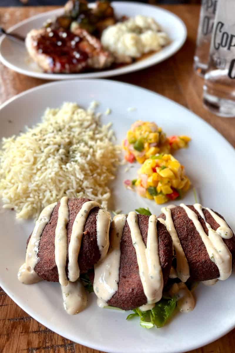 Maryland crab cakes served with rice.