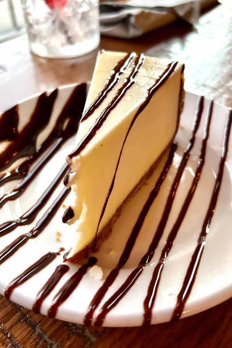 Cheesecake with chocolate drizzle.