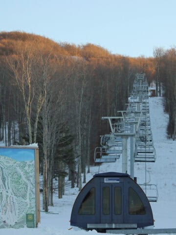 Ski lift at Timberline Mountain with snowy slope in background.
