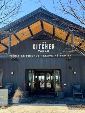 Black exterior of The Kitchen Table restaurant.