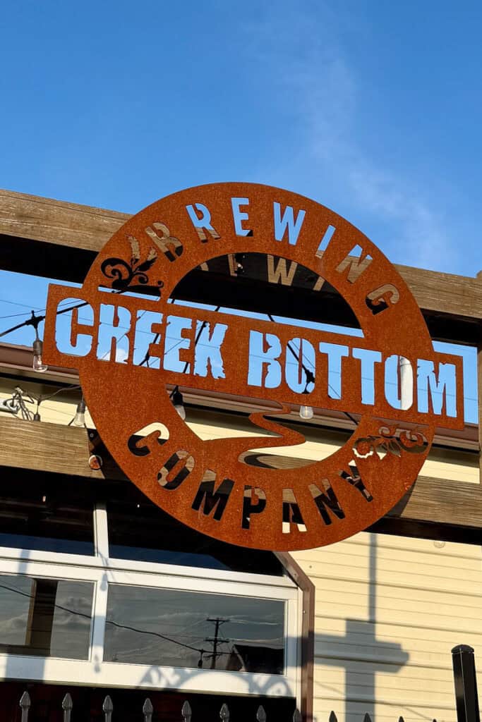 Metal sign with cut-out letters for Creek Bottom Brewing Company.