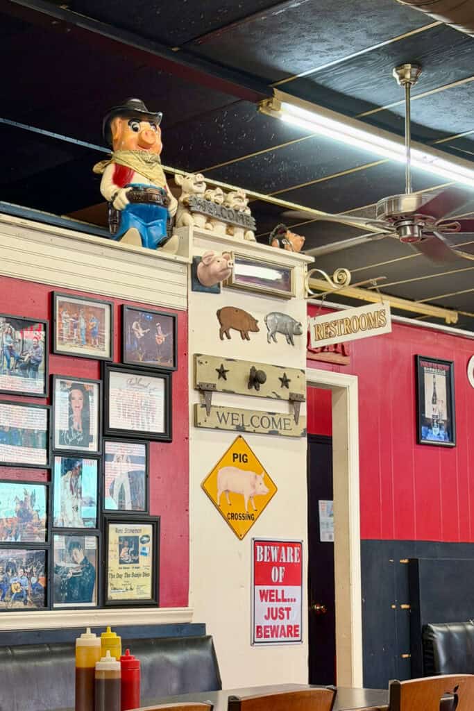 Wall full of pig decor at Galax Smokehouse.