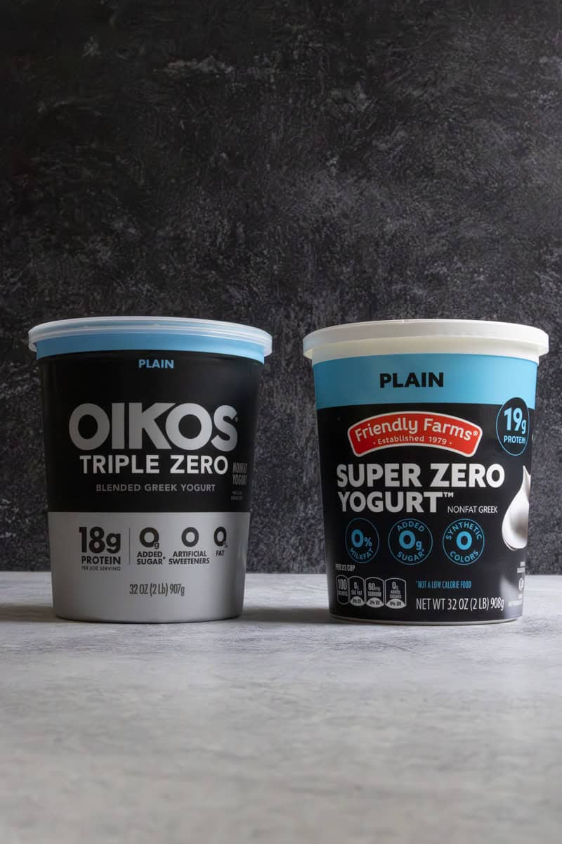 Tubs of Greek yogurt used in making green smoothie cubes.
