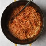 Cooked pasta mixed together with turkey bolognese sauce.
