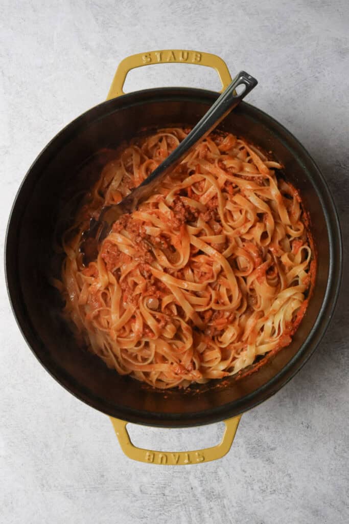 Cooked pasta mixed together with turkey bolognese sauce.