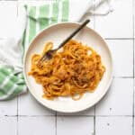 Pasta and turkey bolognese served on plate.