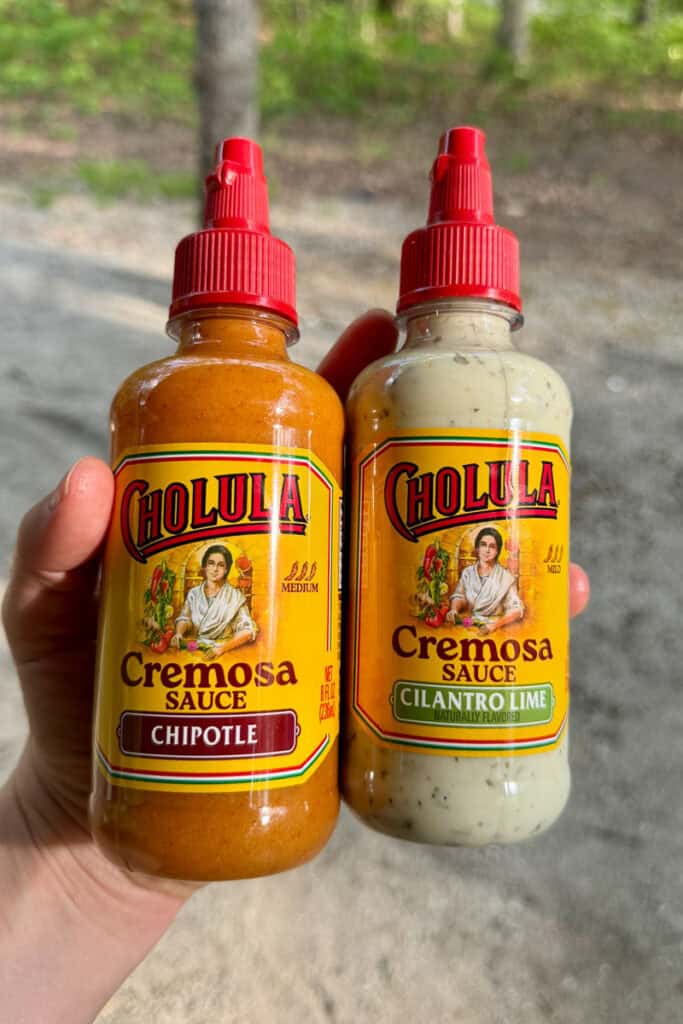Bottles of chipotle and cilantro lime sauce.