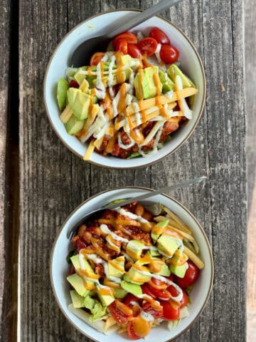 Two bowls full of camping taco salad.