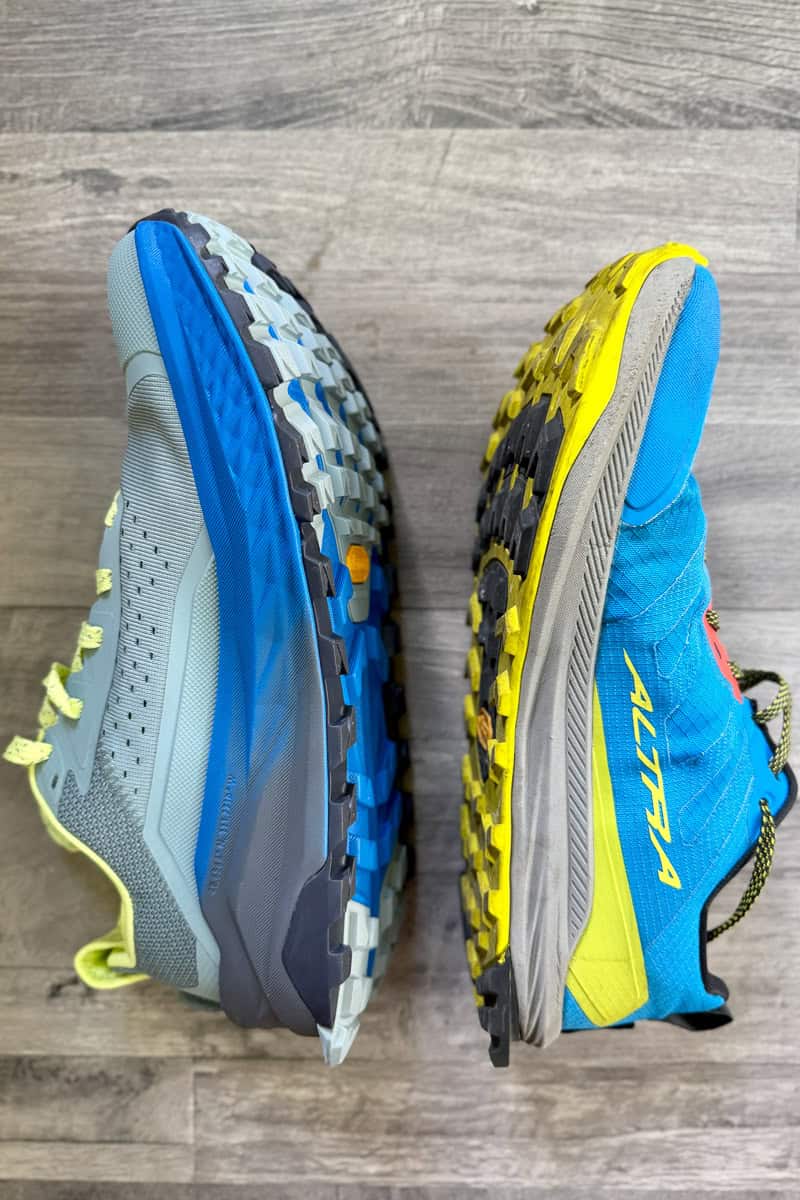 One Olympus 6 Altra shoe and one Lone Peak Altra shoe, turned to show cushioning comparison.