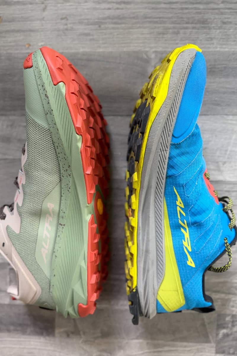One Wild 3+ shoe and one Lone Peak 9+ shoe, turned to compare cushioning levels.