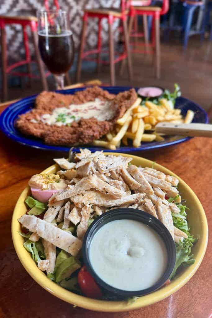 Avocado Meat Candy Salad with chicken, bacon, and tub of blue cheese dressing.