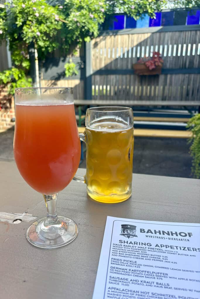 Two glasses filled with beer.
