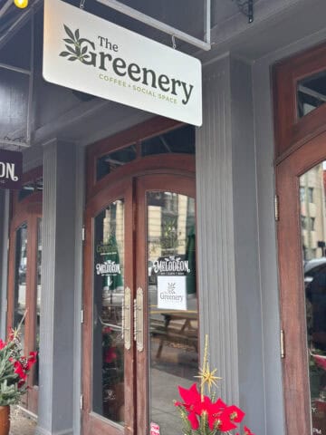 Entrance and sign for The Greenery Coffee Shop.