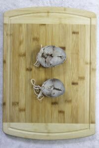 uncooked mackerel steaks bound into a medallion.
