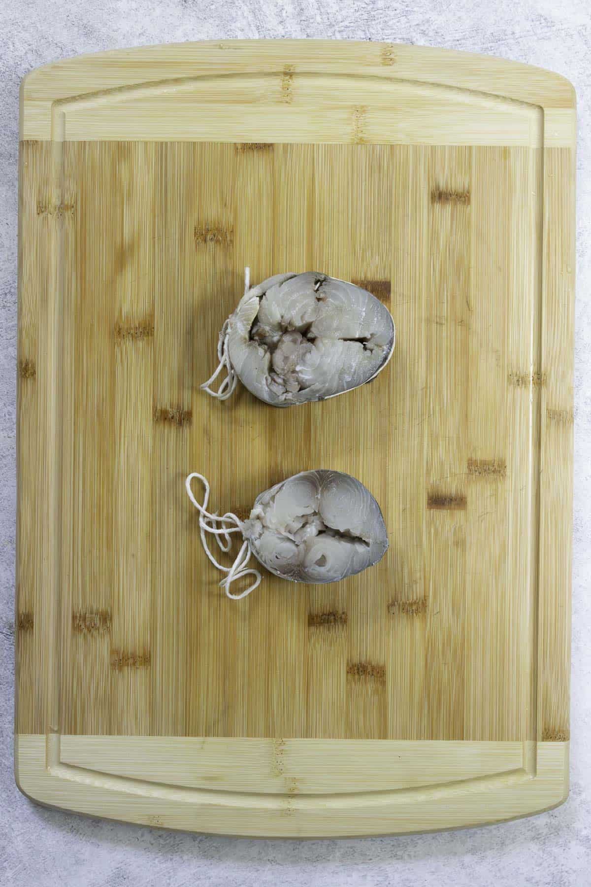 uncooked mackerel steaks bound into a medallion.