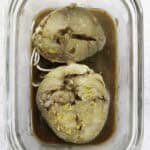 marinating mackerel steaks in a glass dish.