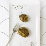 broiled king mackerel steaks on a serving platter.
