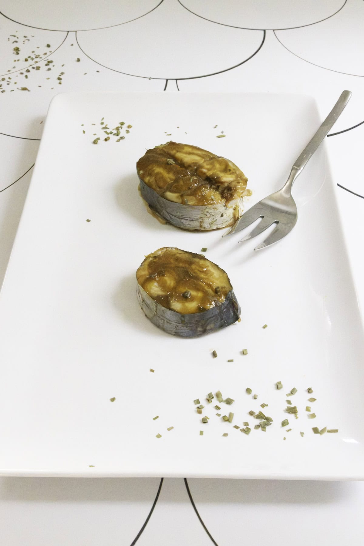 broiled king mackerel steaks on a serving platter.