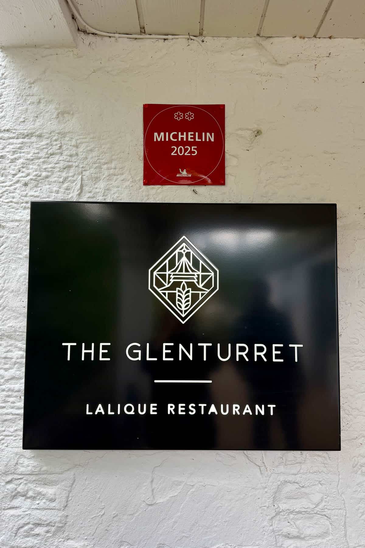 2-star Michelin plaque above Lalique at Glenturret sign.